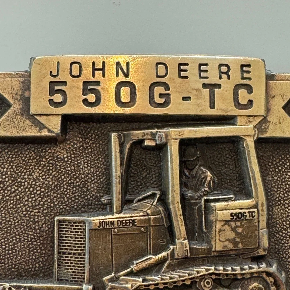John Deere vintage brass
